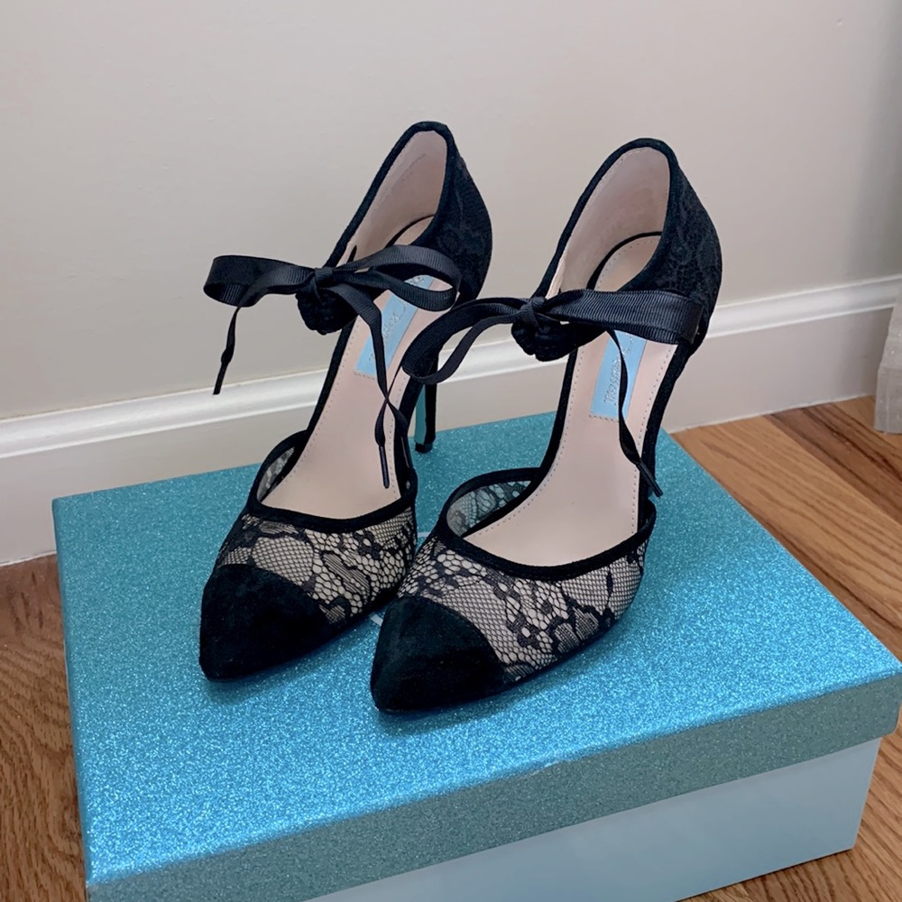 Black lace heels with bow tie. Worn once. Size 6.5